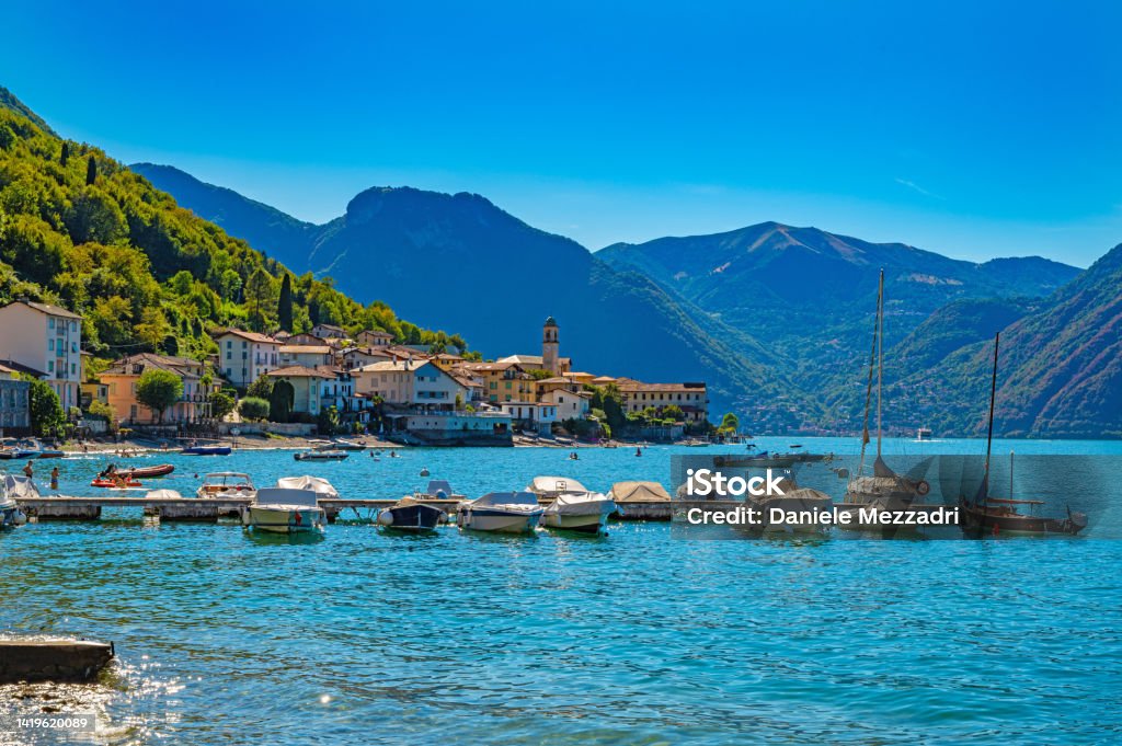 Panorama of Lake Como and the town of Lezzeno. View of Lake Como and the town of Lezzeno, with the church and its village. Built Structure Stock Photo