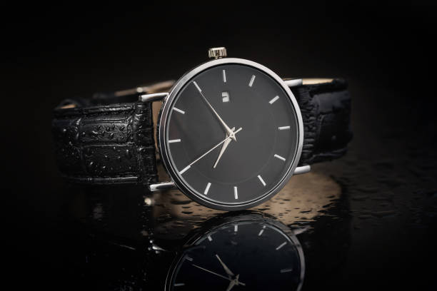 istock Wrist watch with a leather strap on a black background, close-up. 1419621205