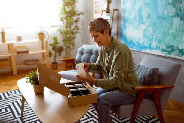 istock Woman unpacking her online order 1419628043
