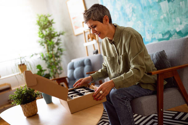istock Woman unpacking her online order 1419628138