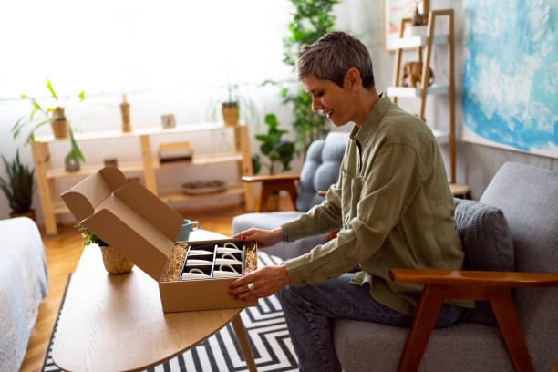 istock Woman unpacking her online order 1419628219