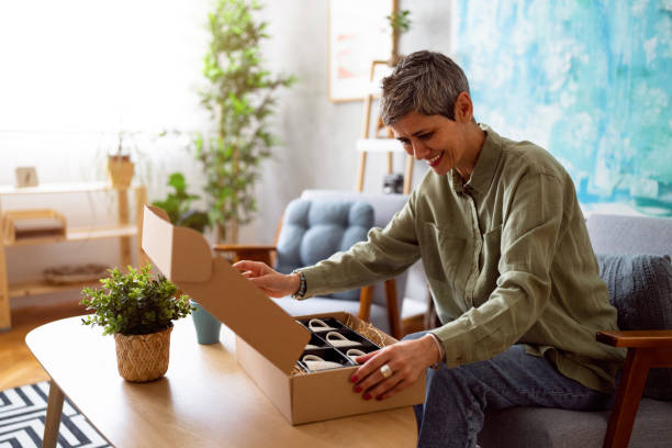 istock Woman unpacking her online order 1419628269