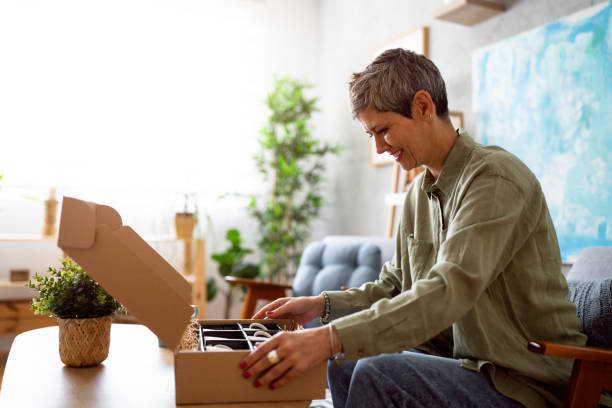 istock Woman unpacking her online order 1419628272