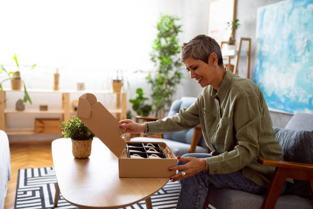 istock Woman unpacking her online order 1419628281