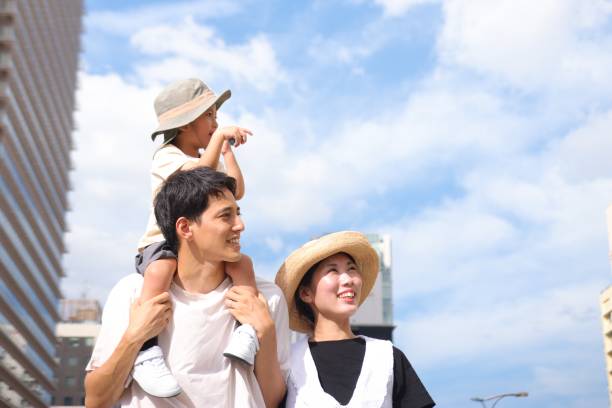 Asian family walking to an event and enjoying a tour stock photo