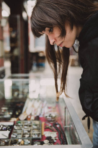 istock Young woman looking market stall 1419634106