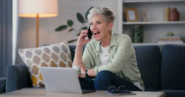 Wow, phone and retirement with a senior woman hearing good news and getting excited in her home. Happy elderly person on a surprise call, feeling excited and connected with online mobile technology