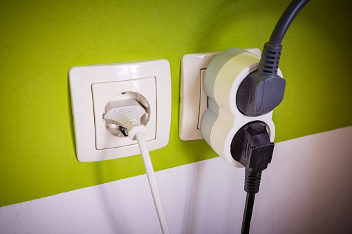 Electrical socket with electrical plug. The global electricity crisis concept.