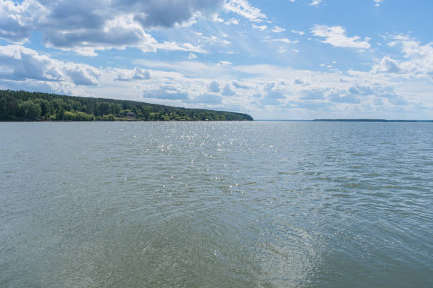 sunny summer day on the river Ob with Karakan forest view and glowing river