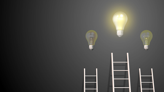 Success concept ladder with glowing light bulb