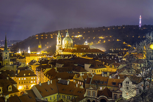 A night view of Prague and its rooftops