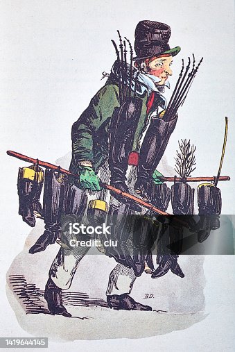 istock Boots cleaner walks with two sticks full of shoes 1419644145