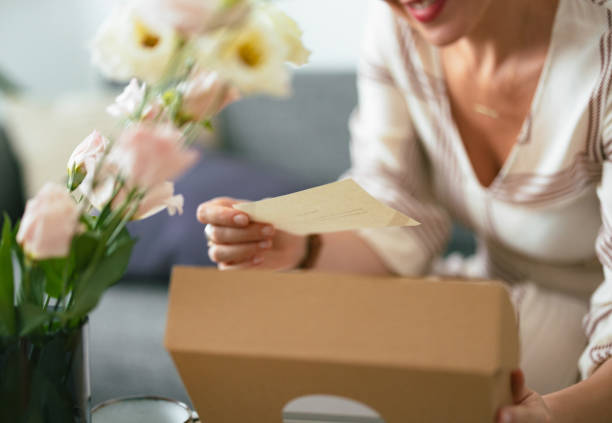 istock Unrecognizable Woman Holding a Note From a Gift Box (Copy Space) 1419645685