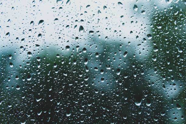 istock Sun after rain. Drops on glass. It's been raining. Texture on glass. 1419645965
