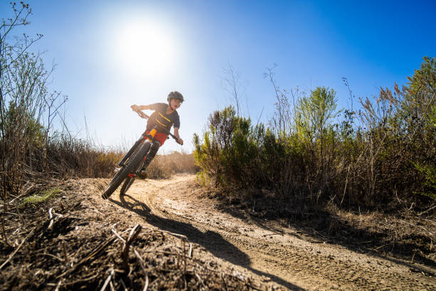 istock A Boy Riding His Mountain Bike in Grasslands 1419647331
