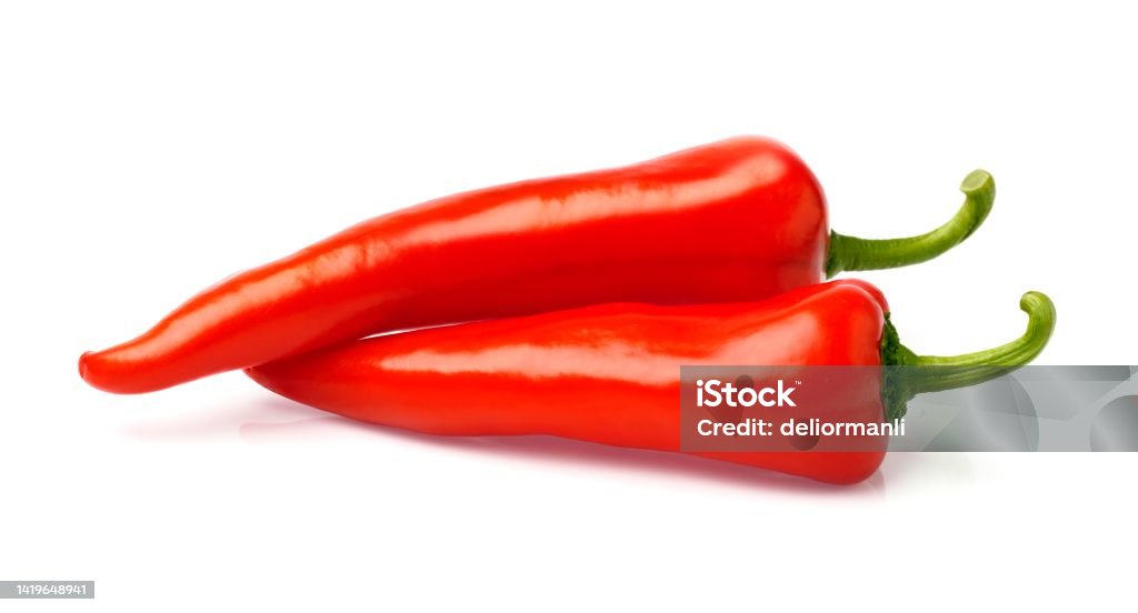 Fresh red peppers on white background Chili Con Carne Stock Photo