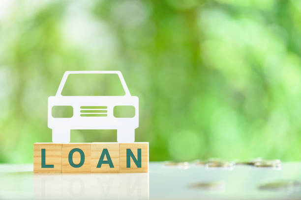 Car or auto loan, financial concept : Sedan car on wood blocks with the word LOAN. Car or auto loan, financial concept : Sedan car on wood blocks with the word LOAN. An auto loan is a secured loan, which means that the value of the vehicle serves as security for the bank or lender. car finance stock pictures, royalty-free photos & images