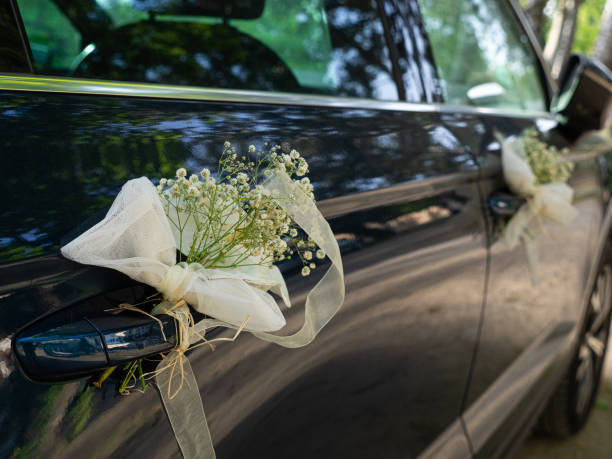 istock Wedding decoration with flowers on the white car 1419652393