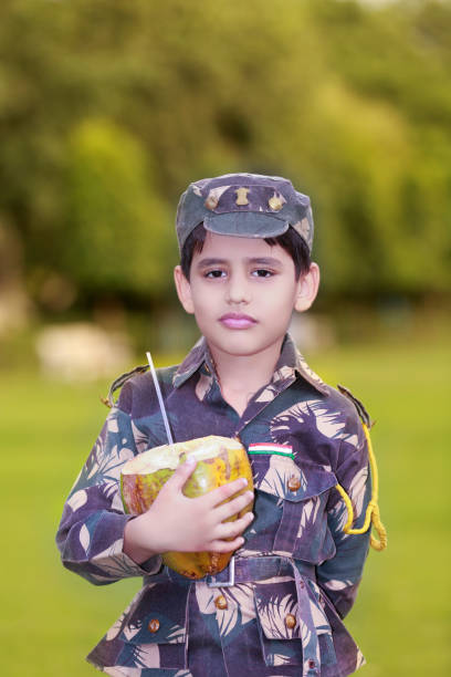 Child drinking coconut water outdoor in nature