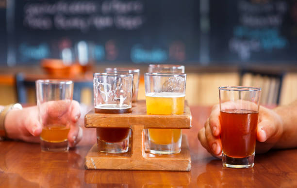 istock Happy hour showing light and dark beers 1419657971