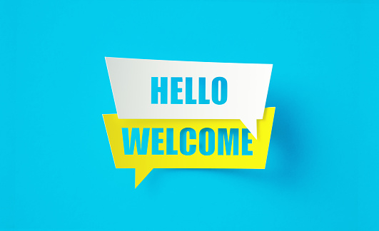 Hello welcome written yellow and white speech bubbles sitting on blue background. Horizontal composition with copy space.
