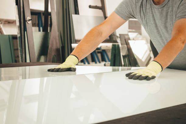 istock a glazier breaks a large white pane on a special table, Glass factory 1419659980