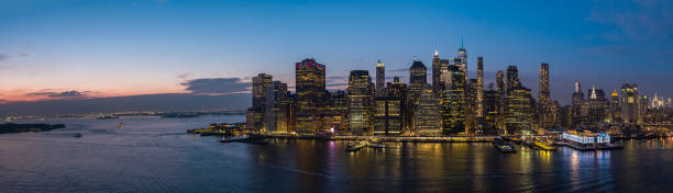 istock Downtown Manhattan panoramic view from the East River at sunset. Extra-large high resolution stitched panorama. 1419664675