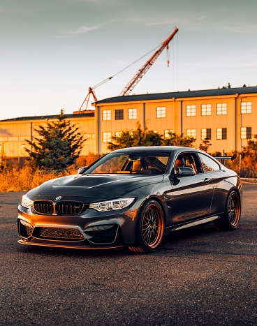 Seattle, WA, USA
August 5, 2022
Black BMW M4 parked showing the car with a building in the background