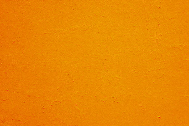 istock Abstract background of orange plaster on the wall. 1419666012