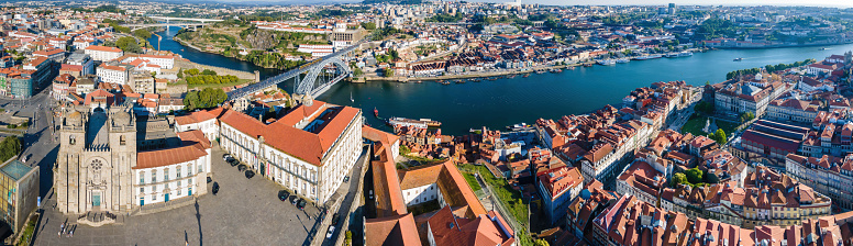An aerial scenic view of Porto Cathedral, the Douro River, Luis I Bridge and the adjacent city districts