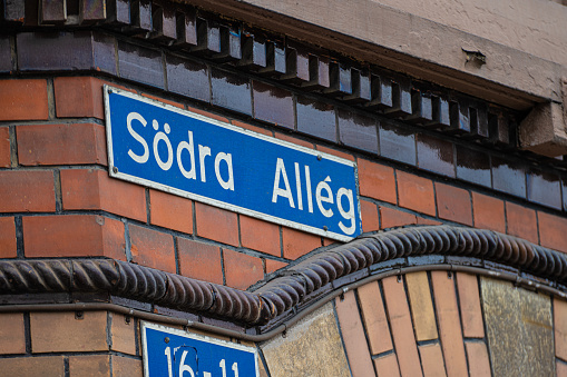 Gothenburg, Sweden - June 06 2022: Sign marking Södra Allegatan on a brick building.
