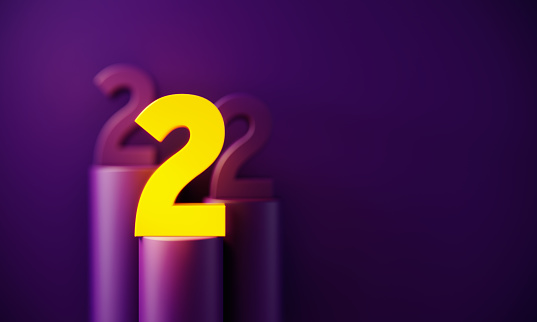 Yellow number two glowing before purple background. Horizontal composition with copy space. Standing out from the crowd concept.