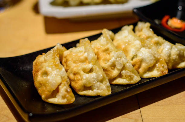 istock Delicious Japanese deep fried gyoza (dumplings) 1419672159