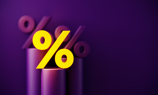 Yellow percentage sign glowing before purple background. Horizontal composition with copy space. Standing out from the crowd concept.