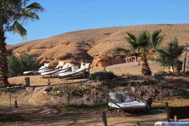 Relaxing place and chairs  at a beautiful tourist camp in moroccan desert. Marrakesh, Marrakesh-Safi, Morocco Chairs at a tourist camp in moroccan desert. Marrakesh, Morocco marrakesh safi photos stock pictures, royalty-free photos & images