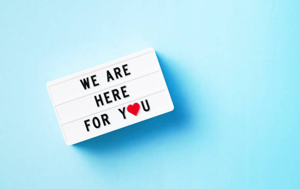 istock We Are Here For You Written White Lightbox Sitting On Blue Background 1419679723