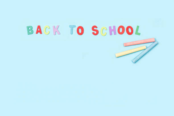 istock Back to school write with colored toy letters and colored chalks on a light blue background 1419680848