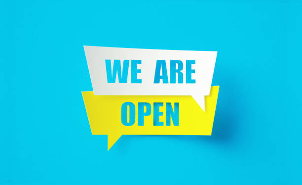 istock We Are Open Written Yellow And White Speech Bubbles Sitting Over Blue Background 1419681002
