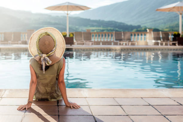 Free Stock Photo of Woman in Hat Sitting on Edge of Swimming Pool ...