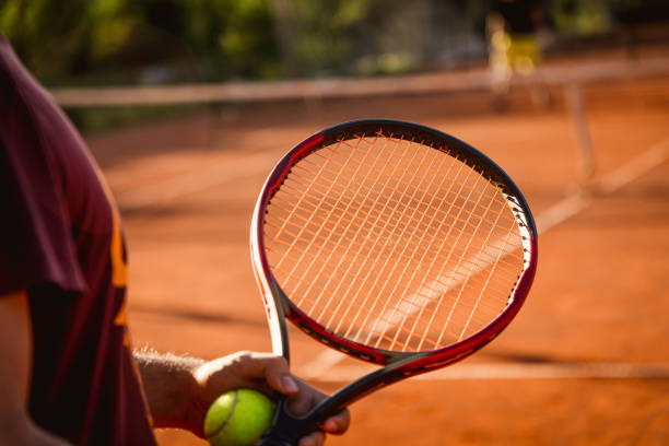 istock Close up of tennis player while preparing for service 1419690281