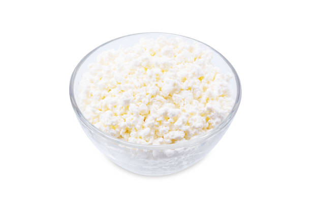 istock Cottage cheese in a bowl on a white isolated background 1419694261