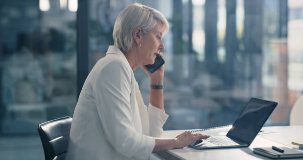 istock Business woman talking on phone, working on laptop computer and networking on internet in office at work. Professional corporate manager and worker making conversation and planning with email 1419696181
