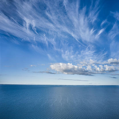Clouds hanging low over the blue sea