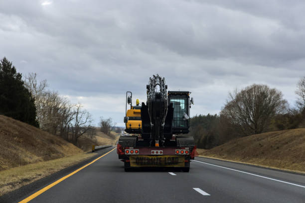 large construction vehicle traveling along the road