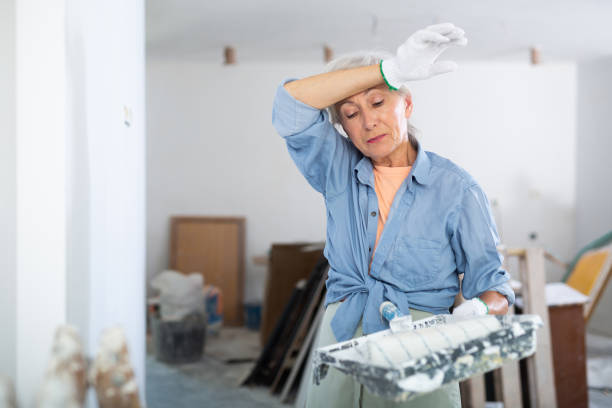 istock Tired mature woman working, diy home renovation 1419708924