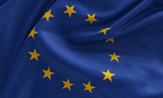 European union flag waving on a green background. Horizontal composition with copy space.