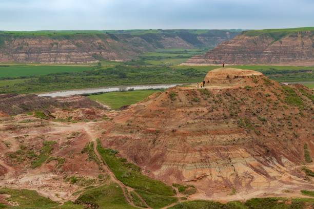 Clouds Over Horsethief Canyon A panoramic cloudy sky over canyons in Drumheller in the summertime. drumheller stock pictures, royalty-free photos & images