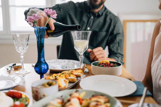 istock An Unrecognizable Man Pouring Wine During Lunch 1419717164