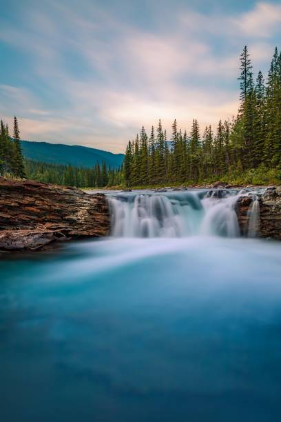 istock Summer Sunrise Long Exposure At Sheep River Falls 1419717740