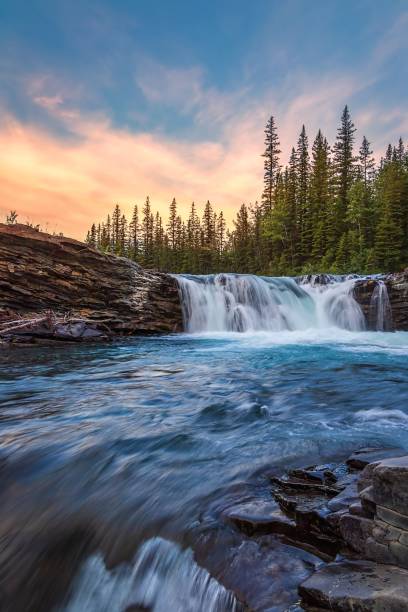 istock Warm Sunrise Over Sheep River Falls 1419718353
